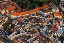 The evening light highlights St. Michael's Hillock with its dominant Jesuit Monastery complex, source: Archiv Vydavatelství MCU s.r.o., ...