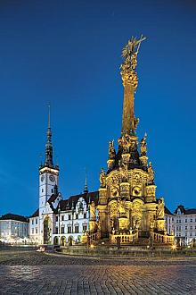 The third base of the column is surrounded by the statues of six saints. The relief decorations in the middle part ofthe column present the six ...